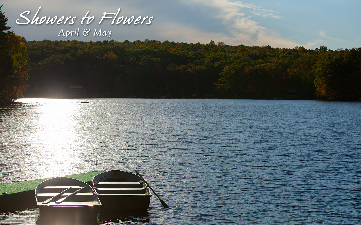 Rowboats on Lake Teedyuskung. Text: Showers to flowers. April & May.